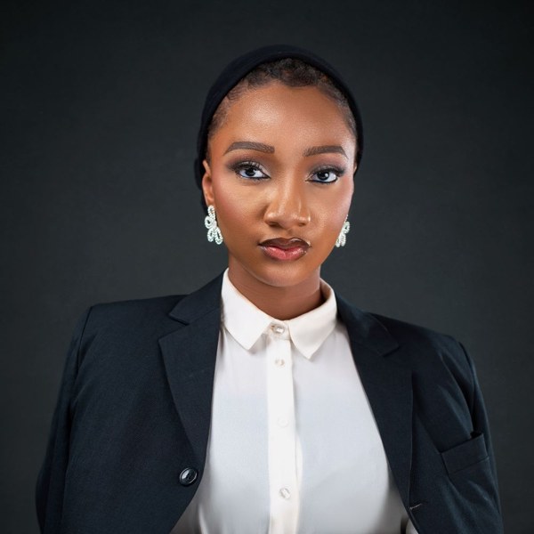 Professional portrait of a businesswoman in a black blazer
